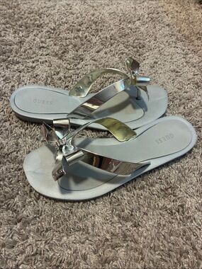 Guess Silver Bow Thong Sandals with Rhinestone Accent